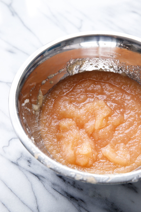 How to make homemade apple butter on the stovetop: the milled apple puree is then cooked down with sugar and spices for nearly an hour, concentrating the crisp apple flavor.