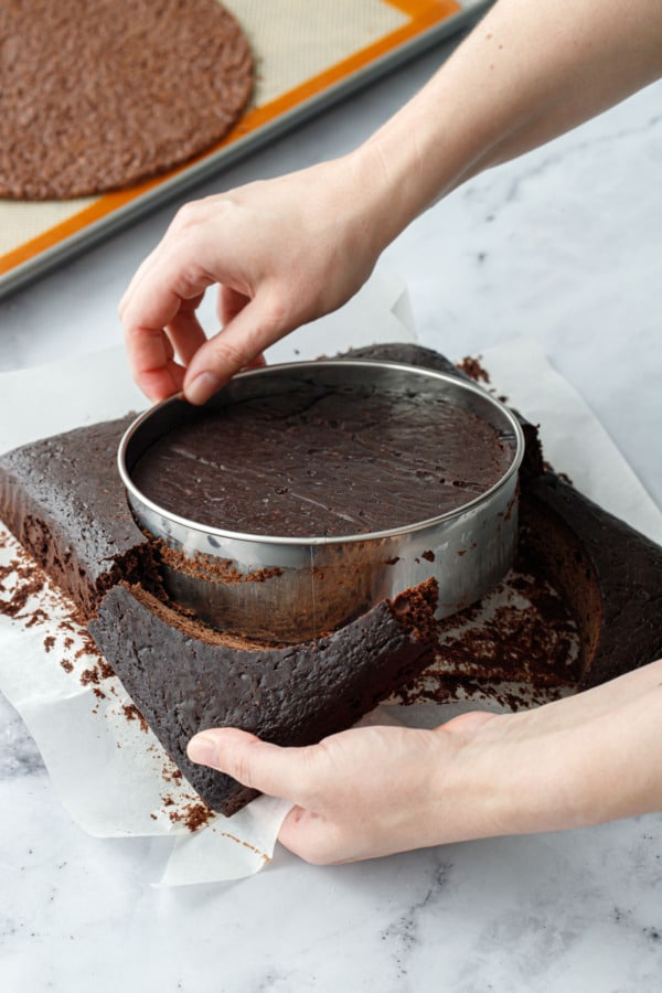 Cutting the baked chocolate cake into a 6-inch circle.