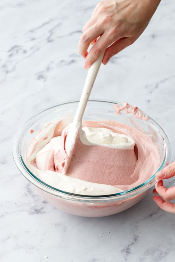 Use a large rubber spatula to fold in the rest of the whipped cream until mixture is smooth and no white streaks remain.