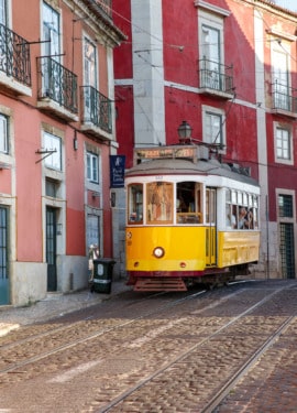 The historic yellow 28E tram line in the Alfama district of Lisbon, Portugal