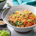 Bowl of Sesame Stir Fry Noodles with Mushrooms, Carrots and Spinach
