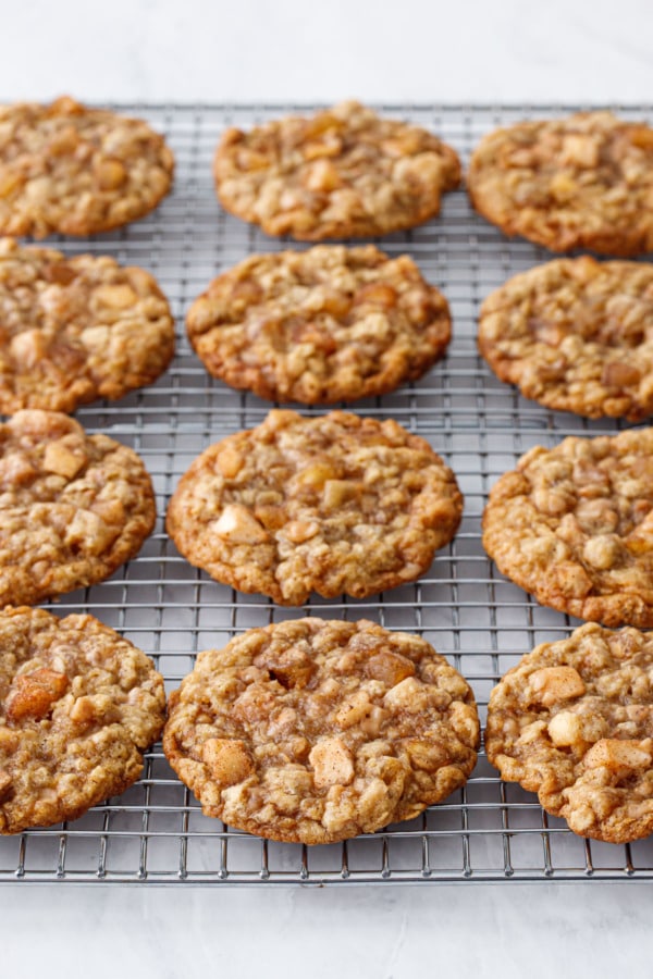 Wire rack with even rows of Toffee Apple Oatmeal Cookies