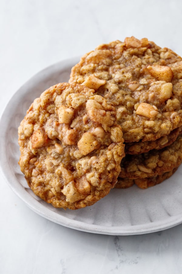 Stack of Toffee Apple Oatmeal Cookies, one tilted off to the side