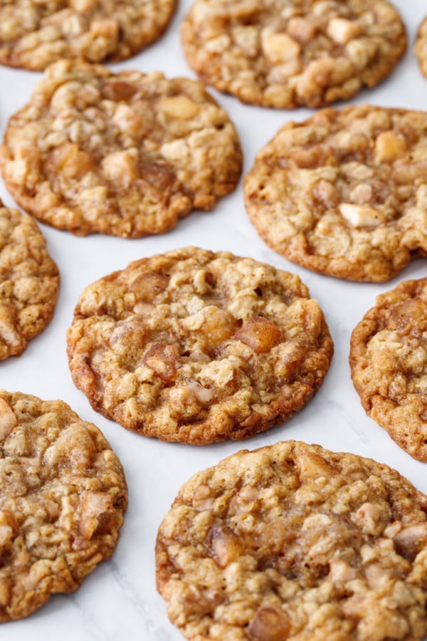 Even pattern of Toffee Apple Oatmeal Cookies on white marble